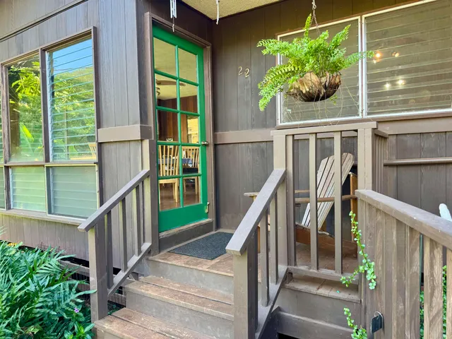 a view of balcony with wooden floor and windows