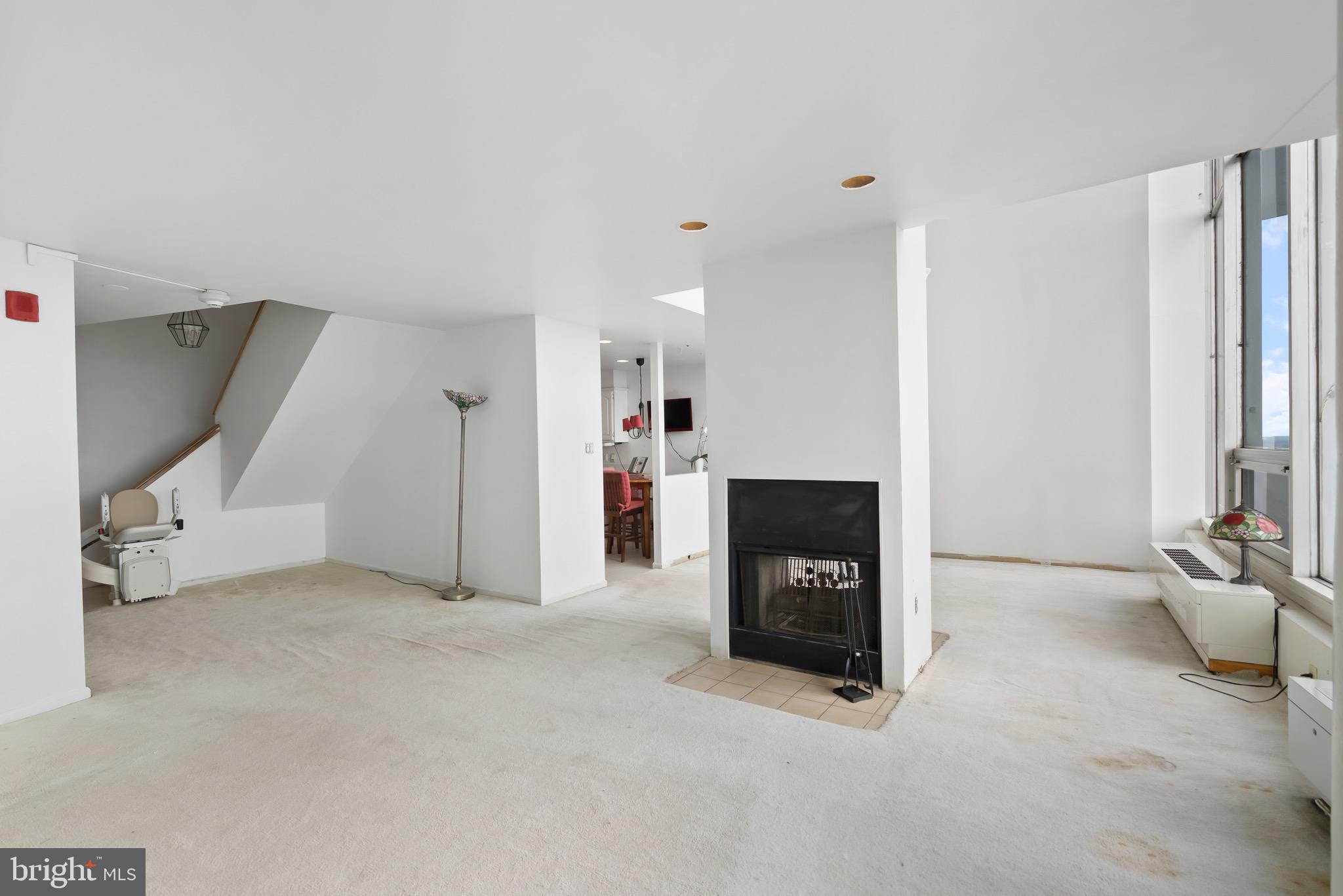 3900 West Ford Road, Unit 23C Philadelphia, PA 19131 - Photo 6 of 28 Living Room with Fireplace
