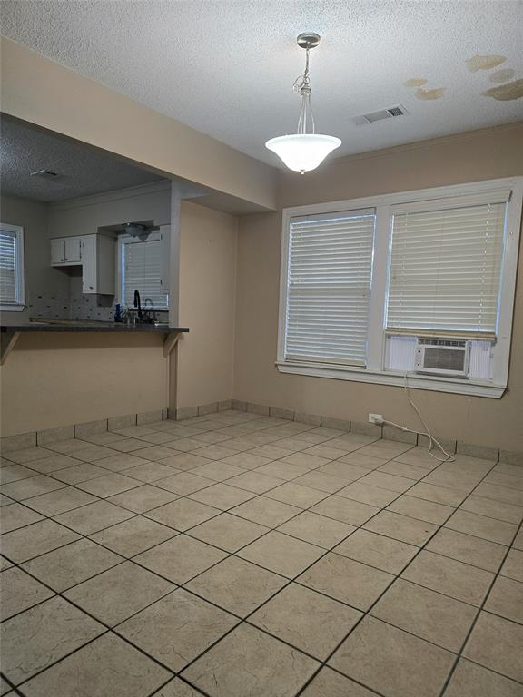 107 Fisk Road Seagoville, TX 75159 - Photo 2 of 3 a view of a kitchen with a sink and cabinets
