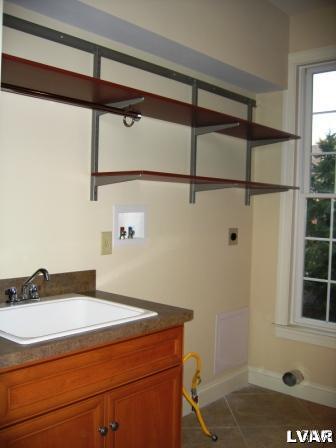 3620 Manor Road Bethlehem, PA 18020 - Photo 30 of 47 Utility sink and shelving in first floor tiled lau