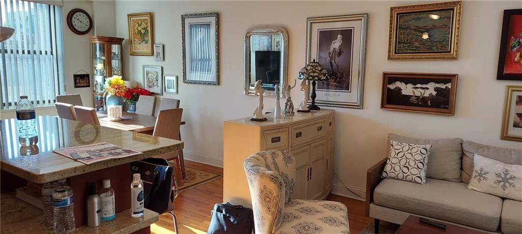 275 Webster Avenue, Unit 2K Brooklyn, NY 11230 - Photo 11 of 22 a living room with furniture and wooden floor