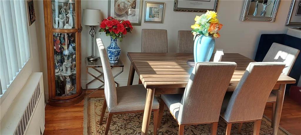 275 Webster Avenue, Unit 2K Brooklyn, NY 11230 - Photo 12 of 22 a dining room with furniture and flowers