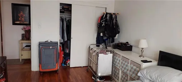 a bed room with a bed and a book shelf