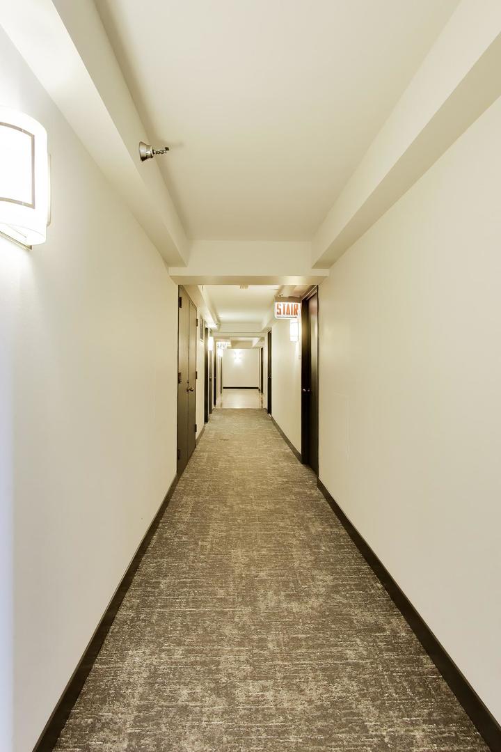 111 West Maple Street, Unit 1503 Chicago, IL 60610 - Photo 9 of 39 a view of hallway