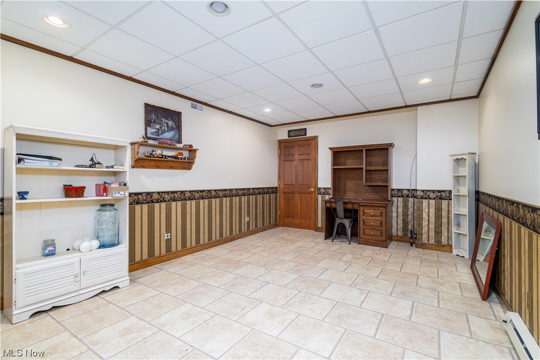 153 Patterson Road Weirton, WV 26062 - Photo 36 of 42 Office area featuring a baseboard heating unit, ornamental molding, light tile floors, and a paneled ceiling