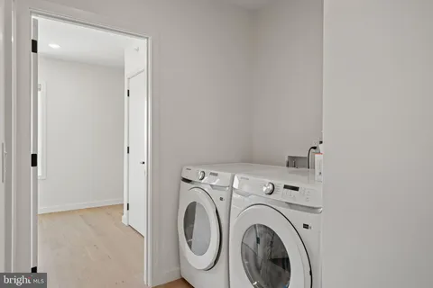 a view of storage and utility room with washer and dryer