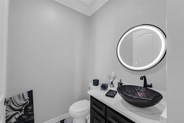 a bathroom with a sink a mirror and a toilet