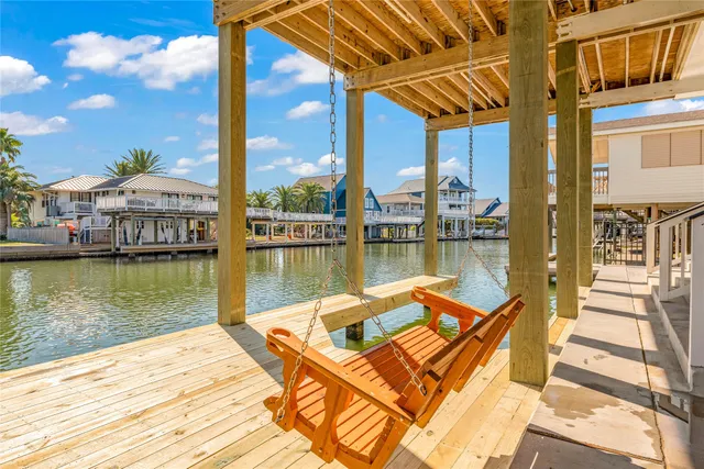 a view of a house with pool and sitting area