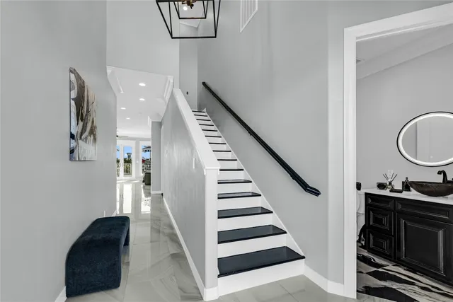 a view of entryway and hall with wooden floor