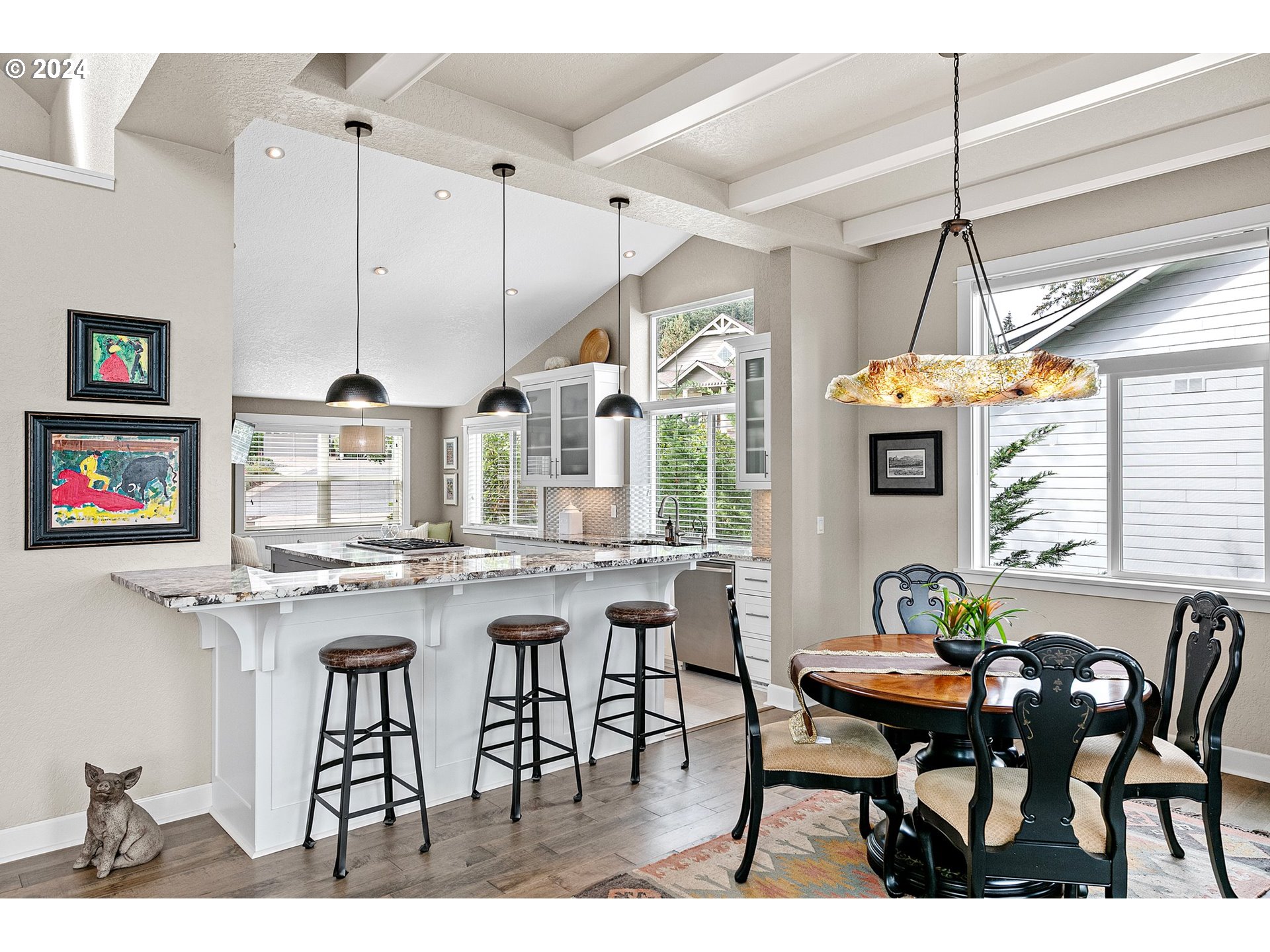 3321 Bentley Avenue Eugene, OR 97405 - Photo 11 of 48 a dinning table and chairs in a kitchen