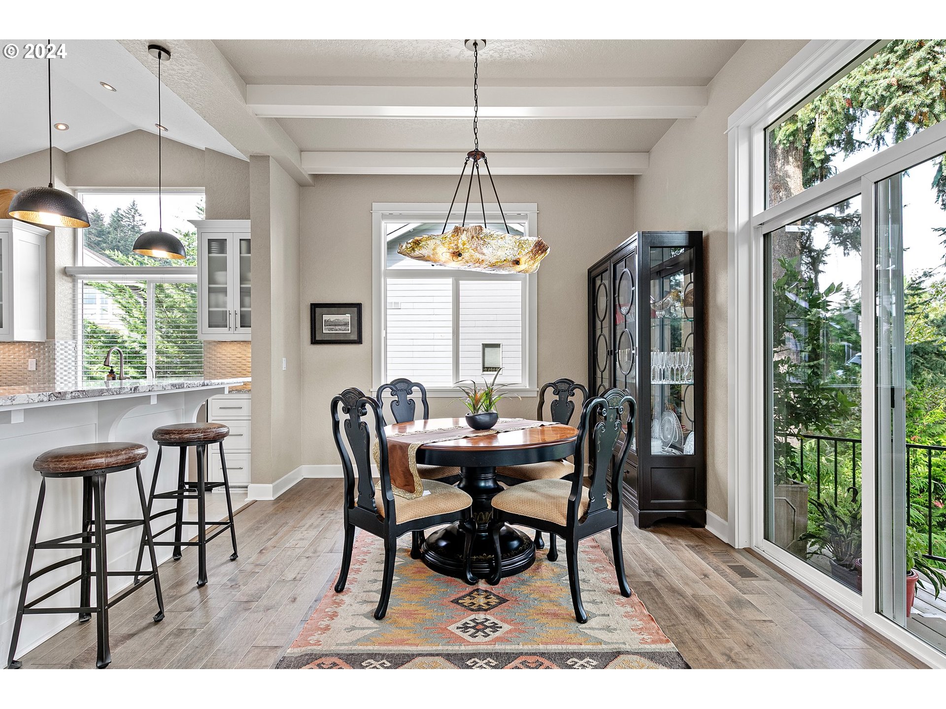 3321 Bentley Avenue Eugene, OR 97405 - Photo 12 of 48 a dining room with furniture a chandelier and wooden floor