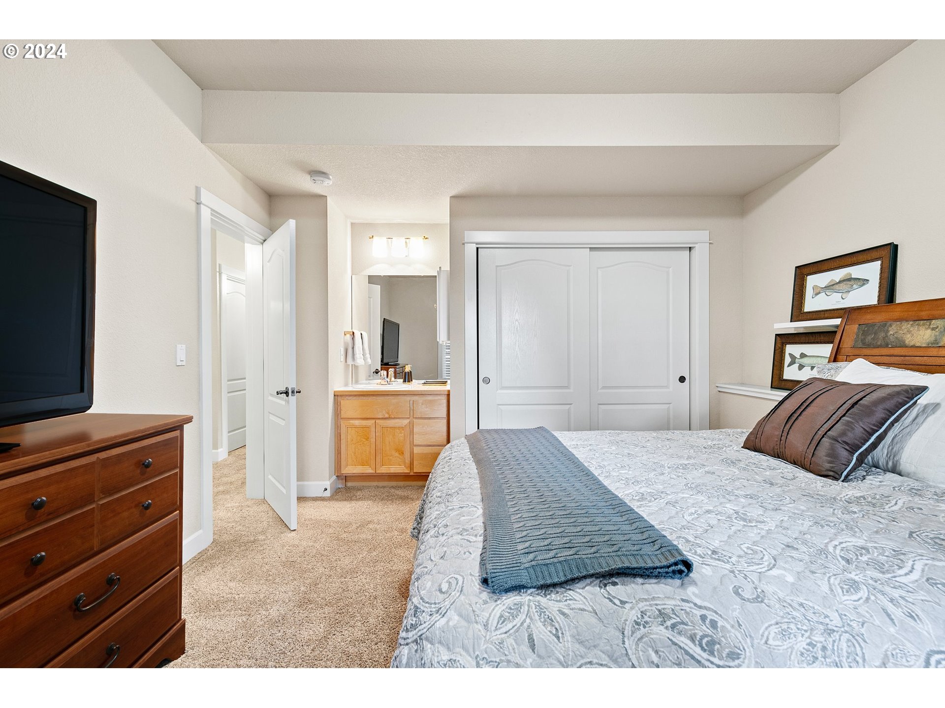 3321 Bentley Avenue Eugene, OR 97405 - Photo 26 of 48 a bedroom with a bed and a flat screen television