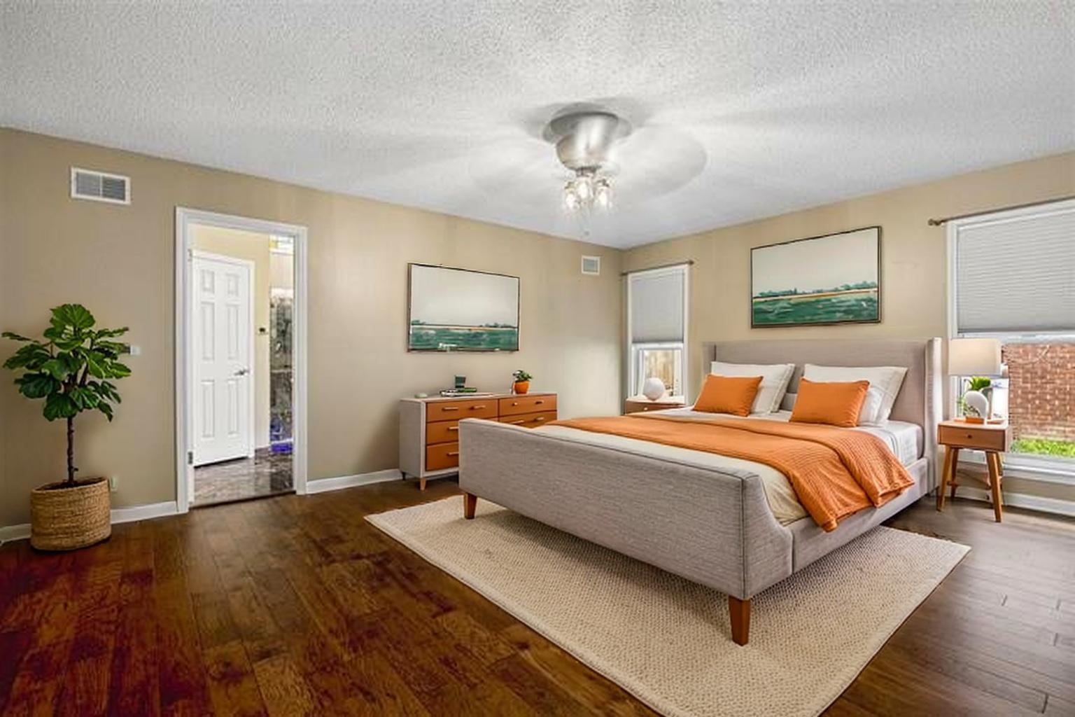 8970 Farmoor Road Germantown, TN 38139 - Photo 10 of 40 Wood-finish flooring, neutral wall tones, multiple windows with blinds, a ceiling fan with integrated lighting, and a white paneled door
