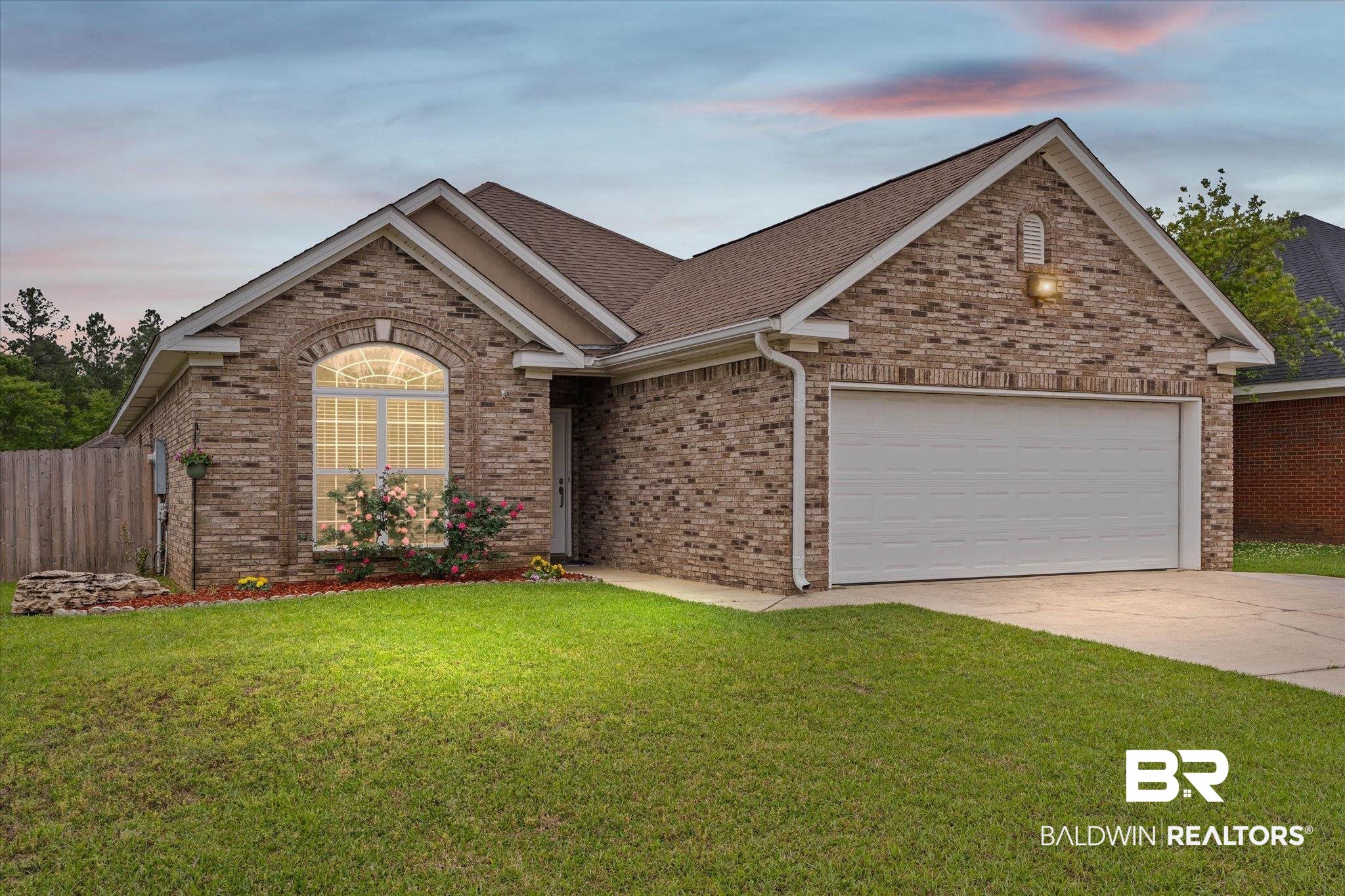 1003 Weatherby Street South Saraland, AL 36571 - Photo 1 of 31 Single story home with brick siding, driveway, a garage, and roof with shingles