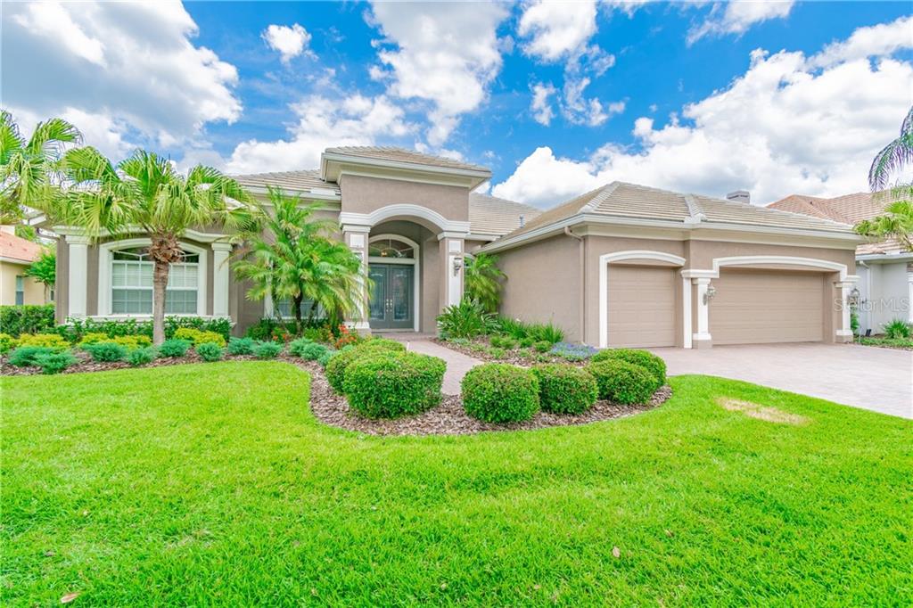 9820 Tree Tops Lake Road Tampa, FL 33626 - Photo 1 of 1 LAKE FRONT 9820 Tree Tops Lake Rd - paved driveway - newer exterior paint- tile roof - 3 car garage