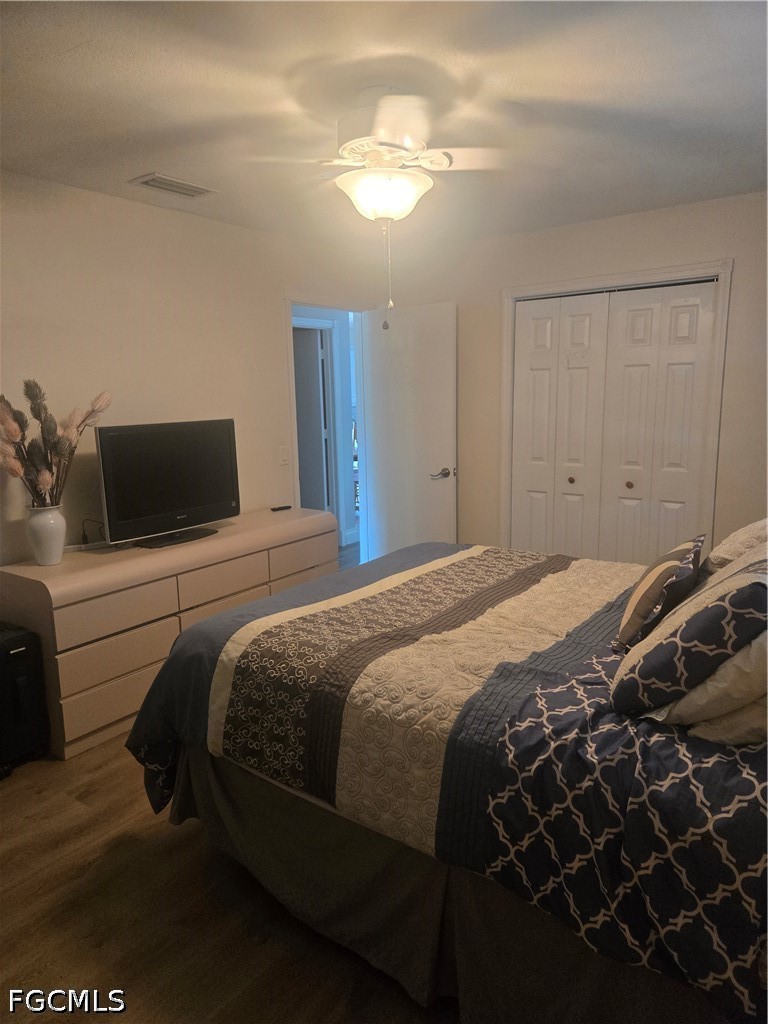 8093 Anhinga Road Fort Myers, FL 33967 - Photo 25 of 49 a bedroom with a bed and a chandelier
