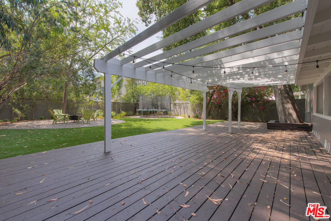 4739 Libbit Avenue Encino, CA 91436 - Photo 18 of 23 a view of a backyard with pathway