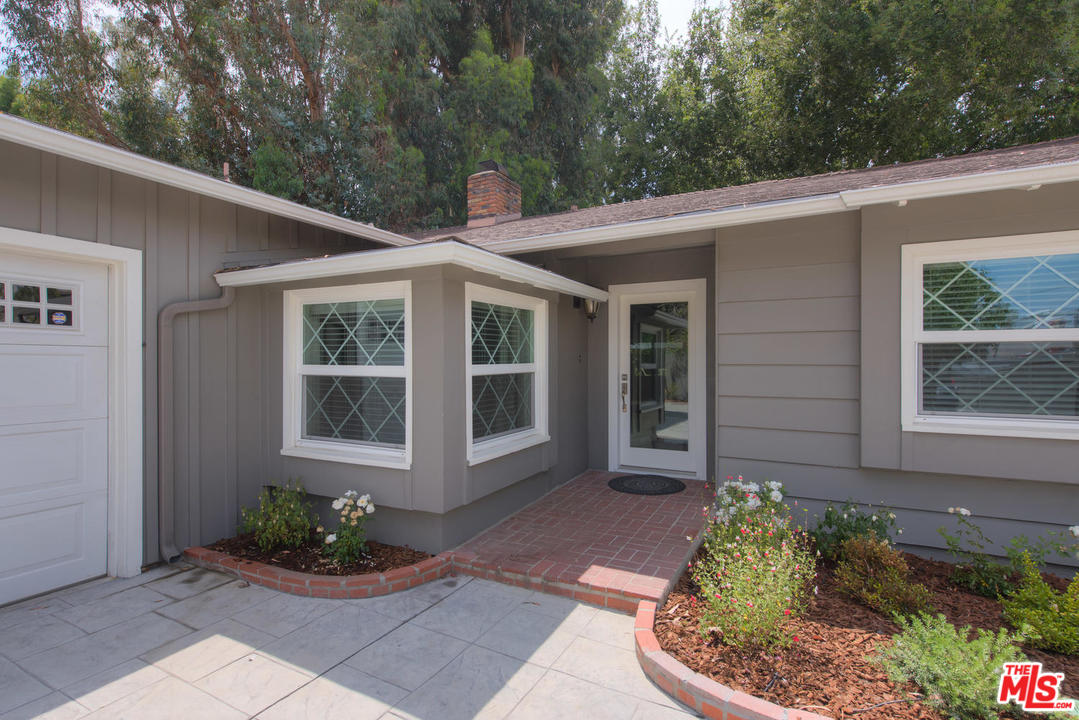 4739 Libbit Avenue Encino, CA 91436 - Photo 2 of 23 a front view of a house with garden