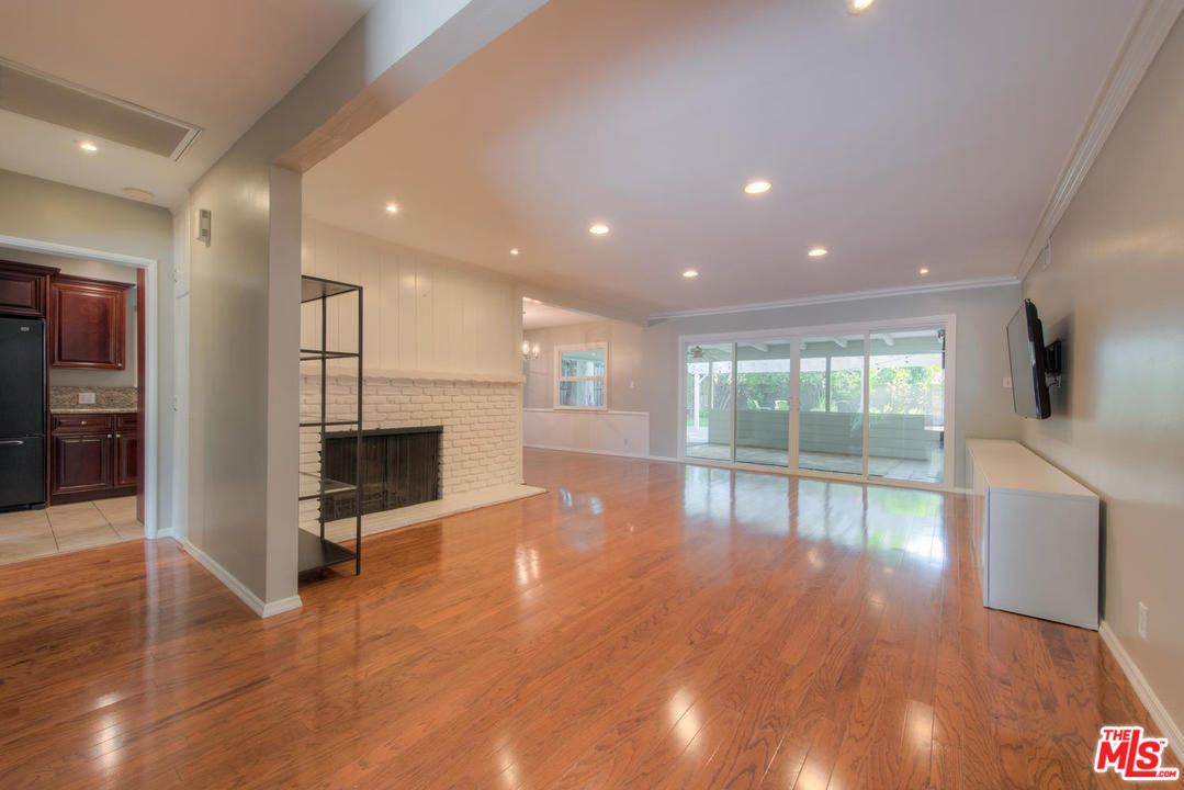 4739 Libbit Avenue Encino, CA 91436 - Photo 4 of 23 a view of a kitchen with a sink and a large window