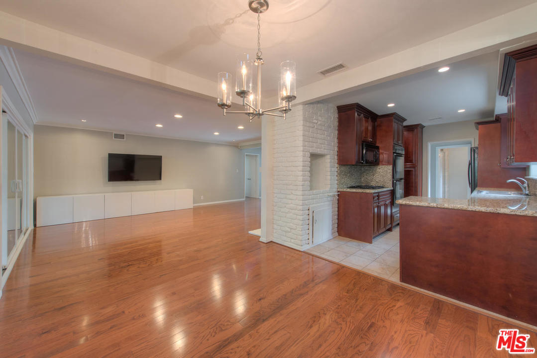 4739 Libbit Avenue Encino, CA 91436 - Photo 10 of 23 a view of kitchen with refrigerator microwave and stove
