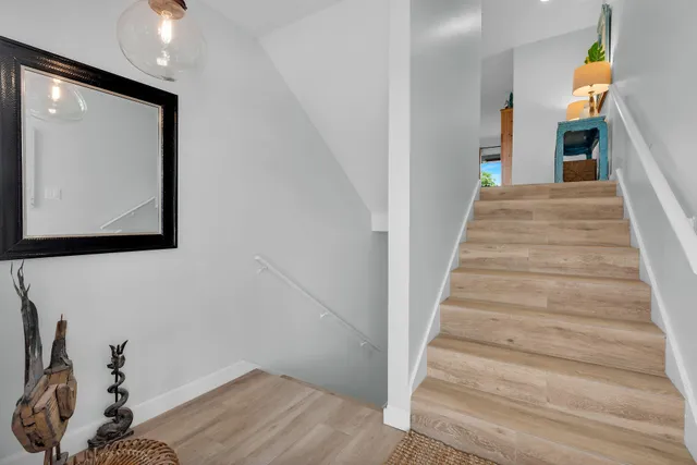 a front view of a house with a yard and fountain