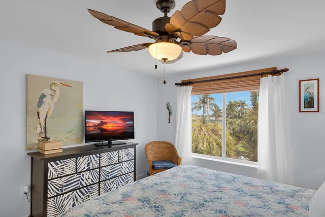 a view of a balcony with chair and a window