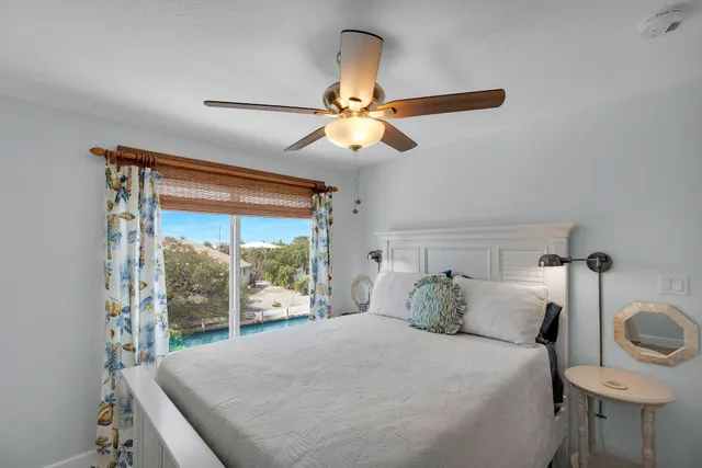 a bathroom with a granite countertop sink a toilet and a shower