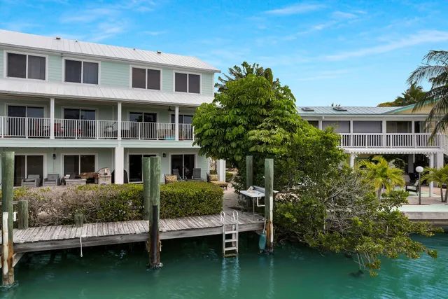 a kitchen with sink refrigerator and outdoor view