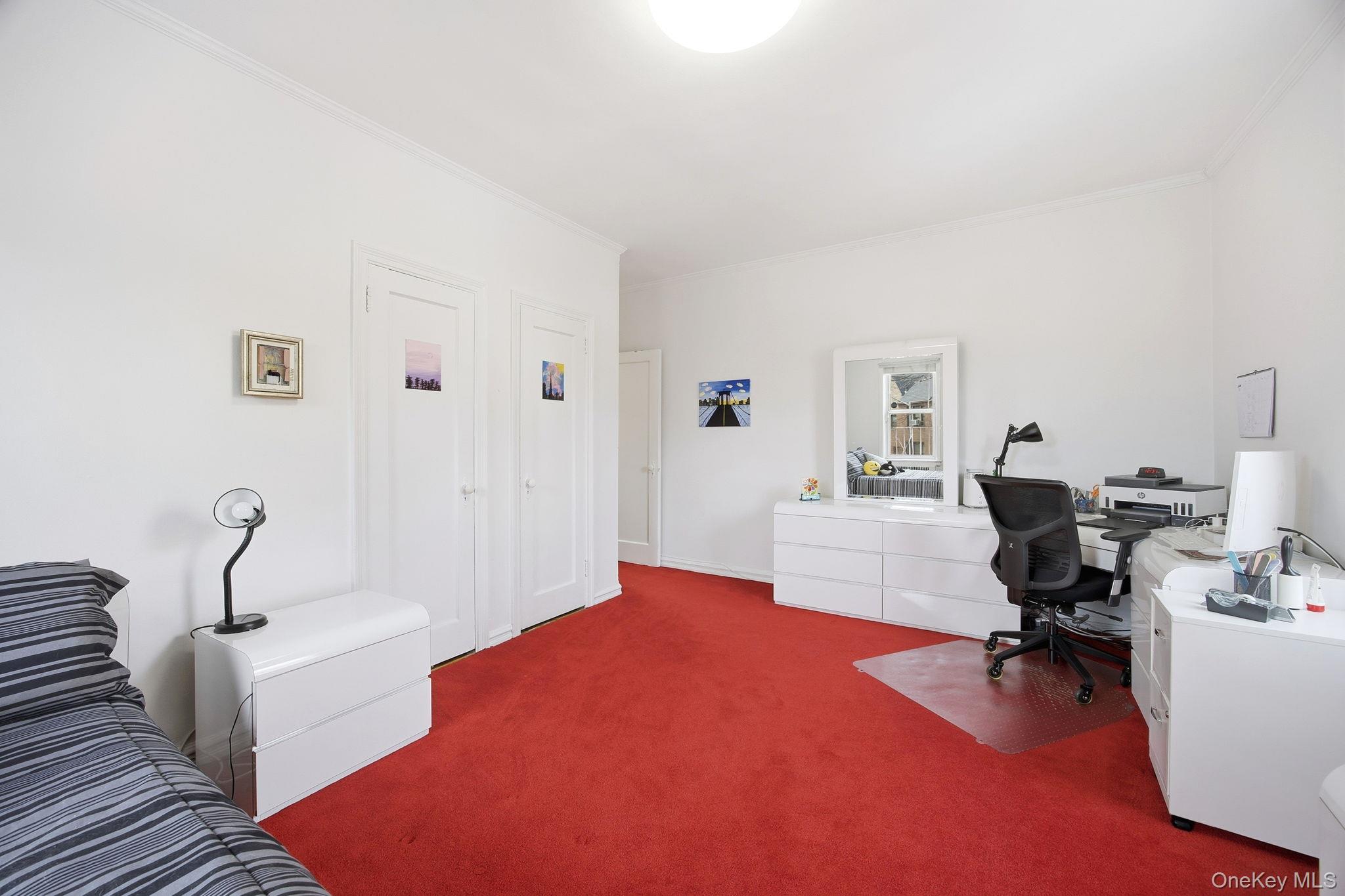 124-16 84th Road, Unit 2E Queens, NY 11415 - Photo 11 of 22 a workspace with a couch and a window