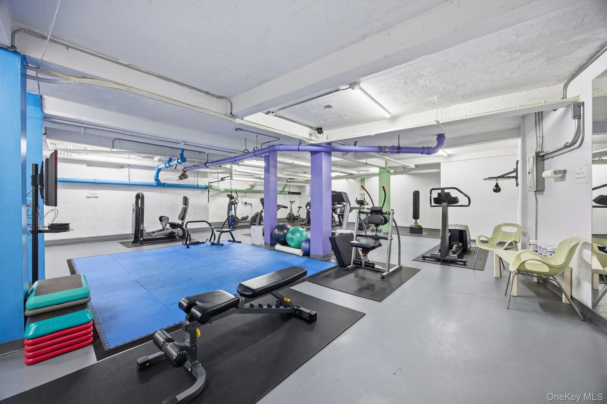 124-16 84th Road, Unit 2E Queens, NY 11415 - Photo 19 of 22 a view of a room with gym equipment