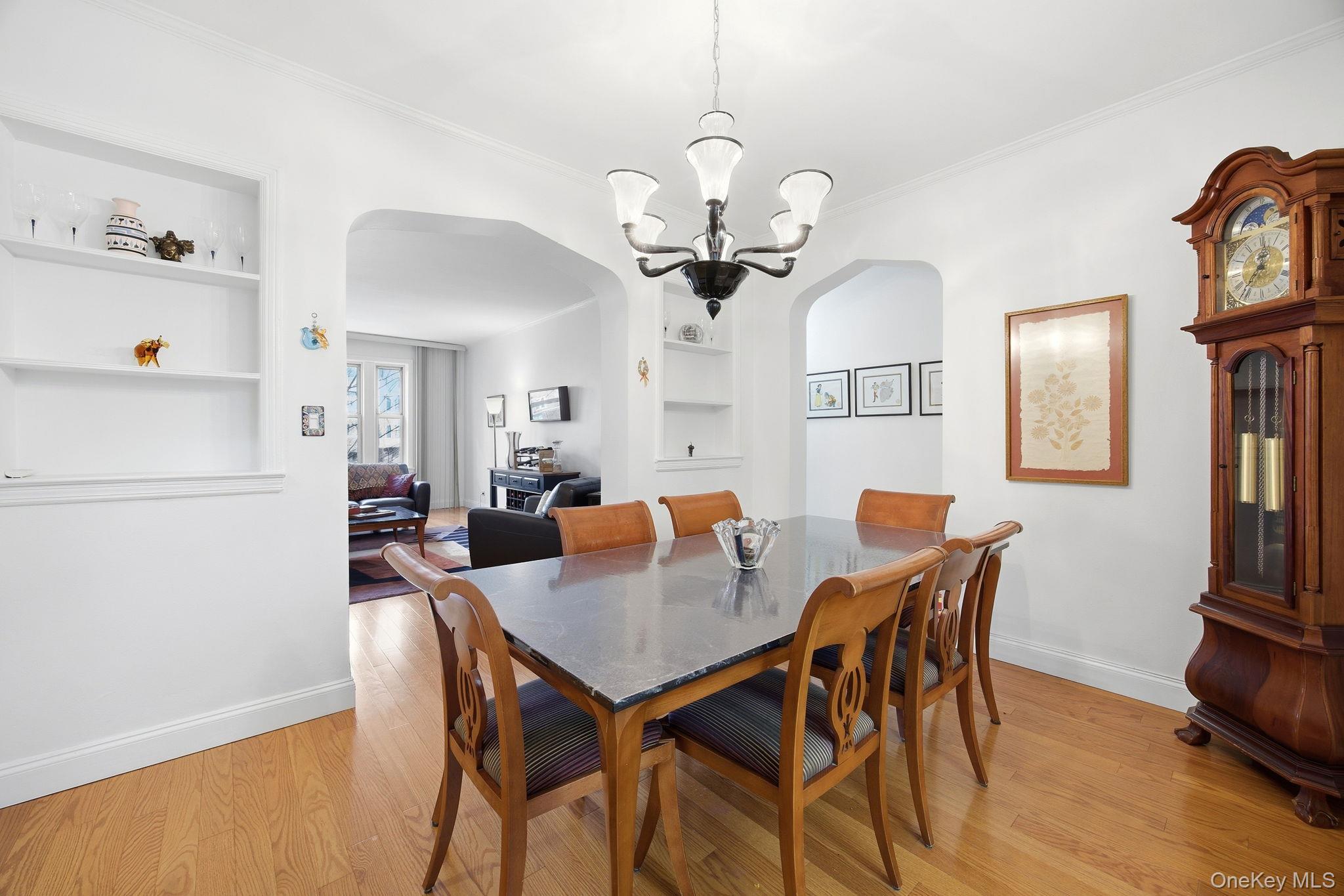 124-16 84th Road, Unit 2E Queens, NY 11415 - Photo 2 of 22 a view of a dining room with furniture