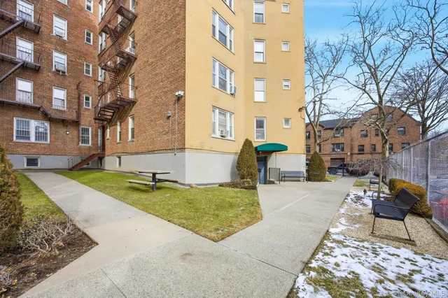 a view of a patio with a yard