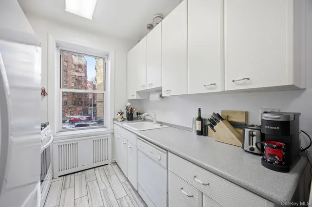 a kitchen with a sink and cabinets