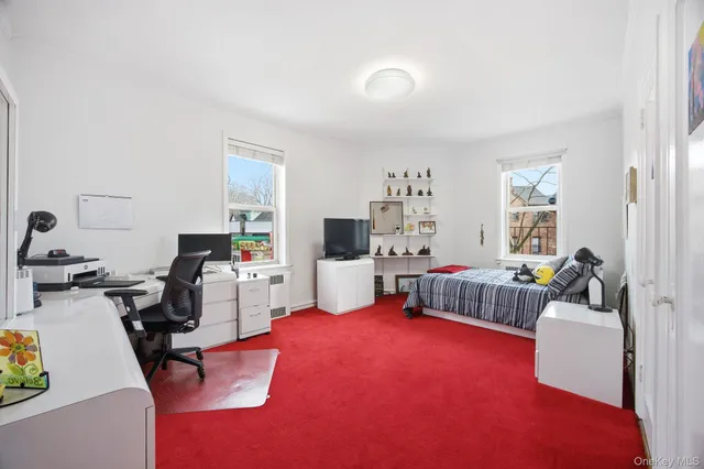 a bedroom with furniture and a bed