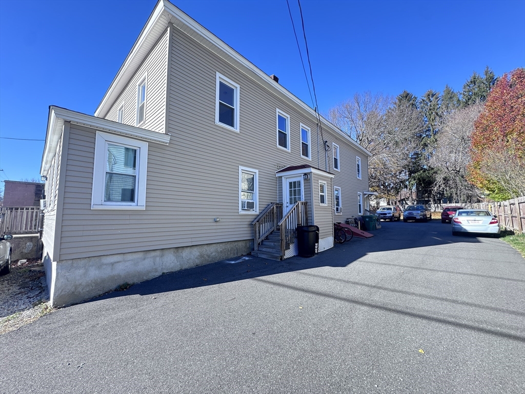 116-118 Lawrence Street, Unit 1REAR Clinton, MA 01510 - Photo 11 of 13 a view of a house with a patio