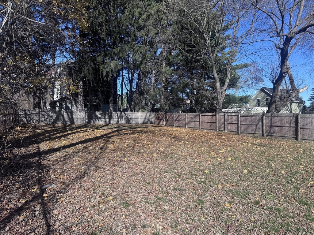 116-118 Lawrence Street, Unit 1REAR Clinton, MA 01510 - Photo 12 of 13 a view of outdoor space with wooden fence