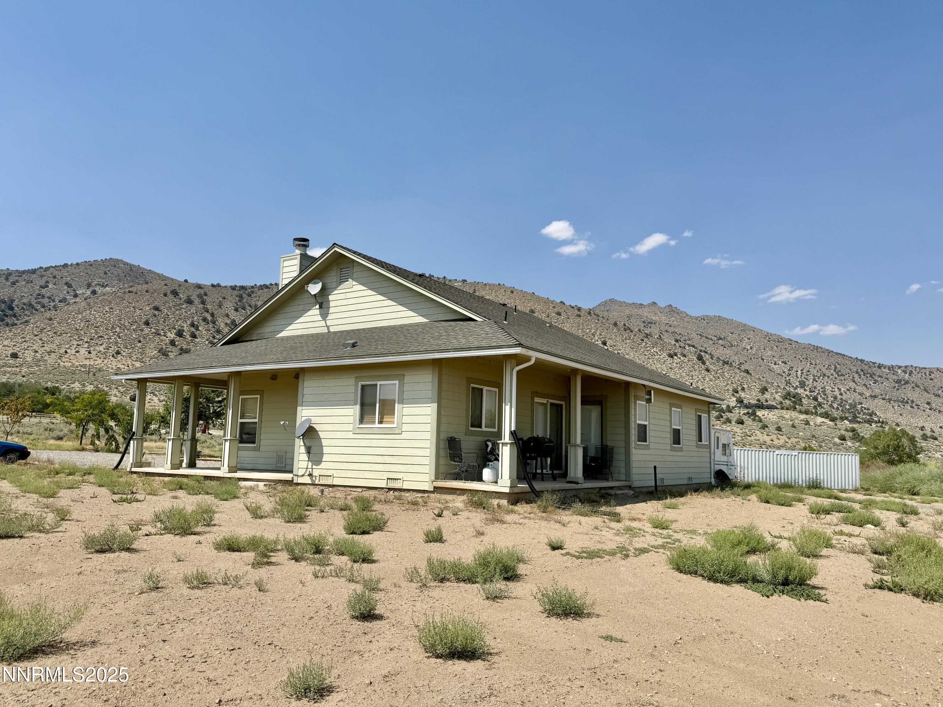 52 Upper Colony Road Wellington, NV 89444 - Photo 16 of 21 a front view of a house with a yard