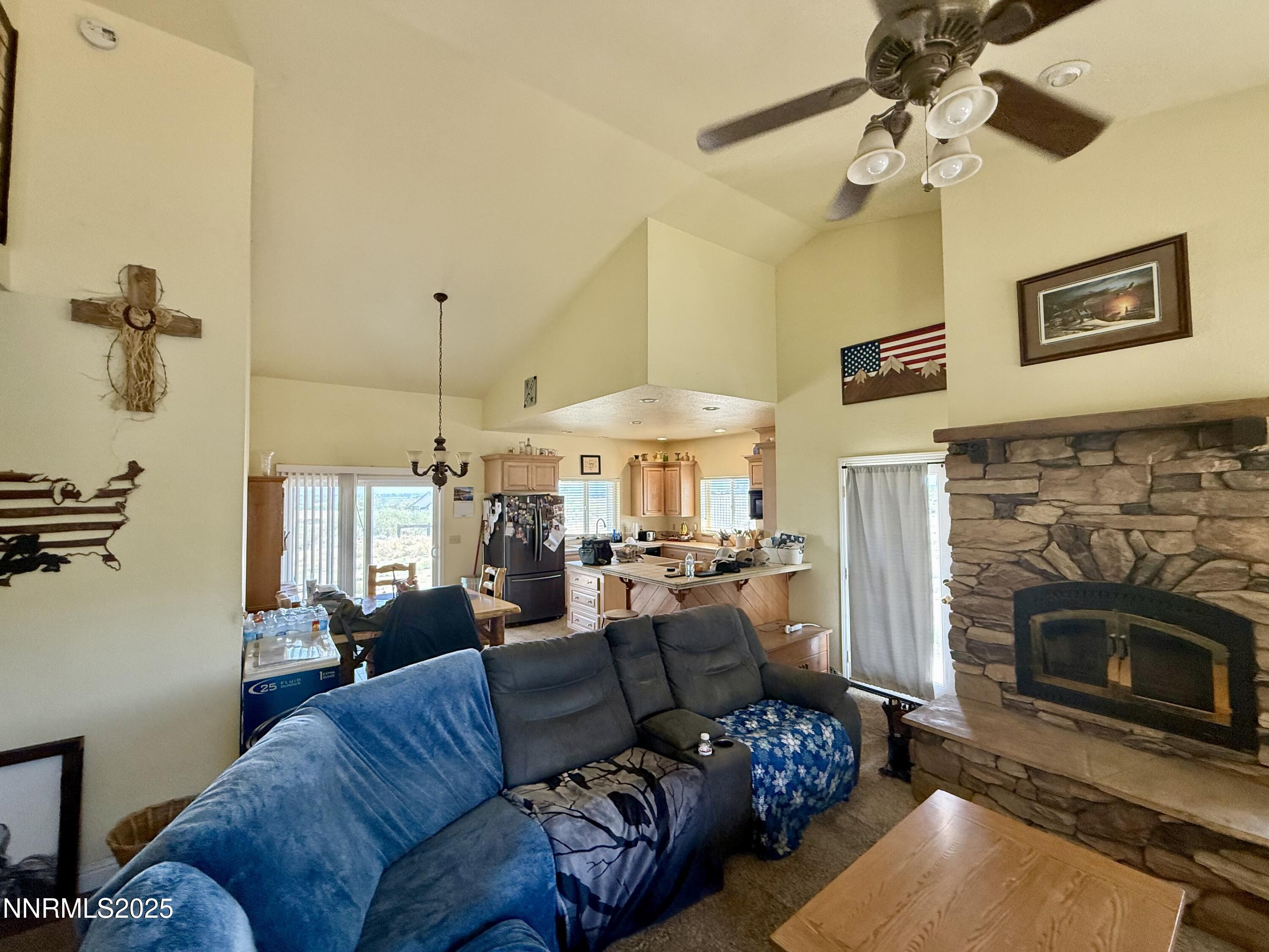52 Upper Colony Road Wellington, NV 89444 - Photo 3 of 21 a living room with furniture and a fireplace