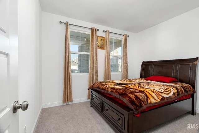 a view of storage and utility room with racks on the wall