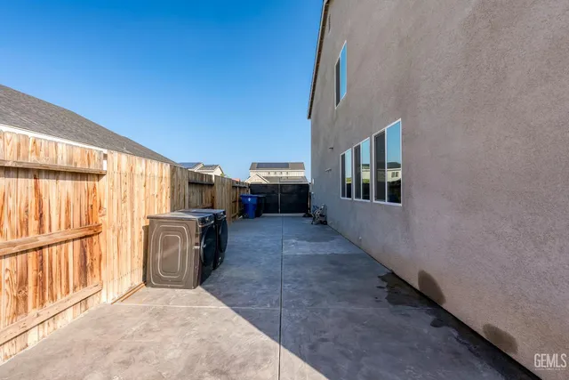 a patio with table and chairs