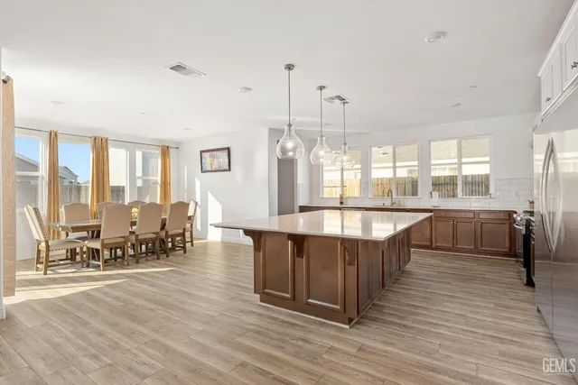 a large room with wooden floor and windows