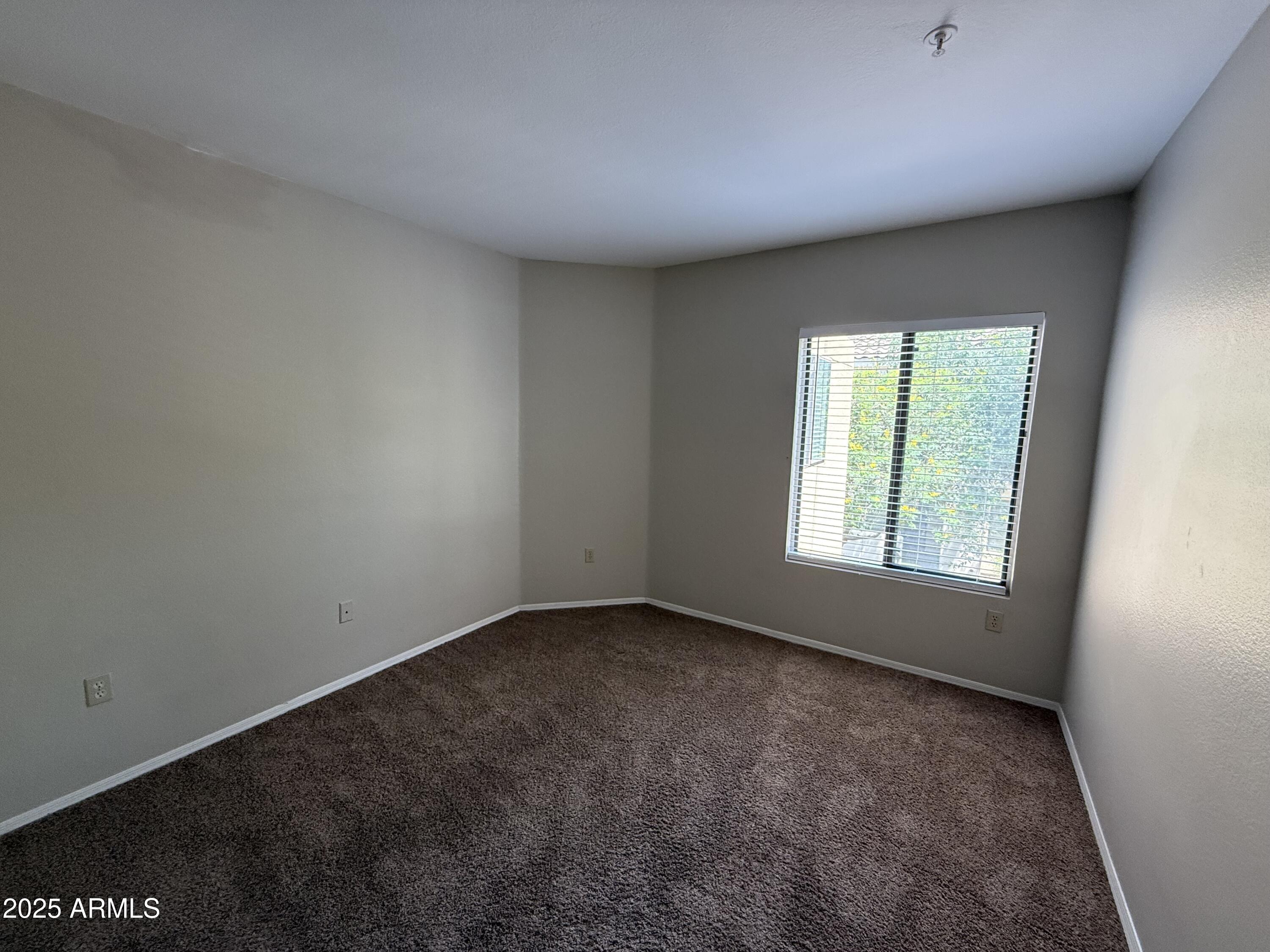 7575 East Indian Bend Road, Unit 2124 Scottsdale, AZ 85250 - Photo 11 of 32 an empty room with a window