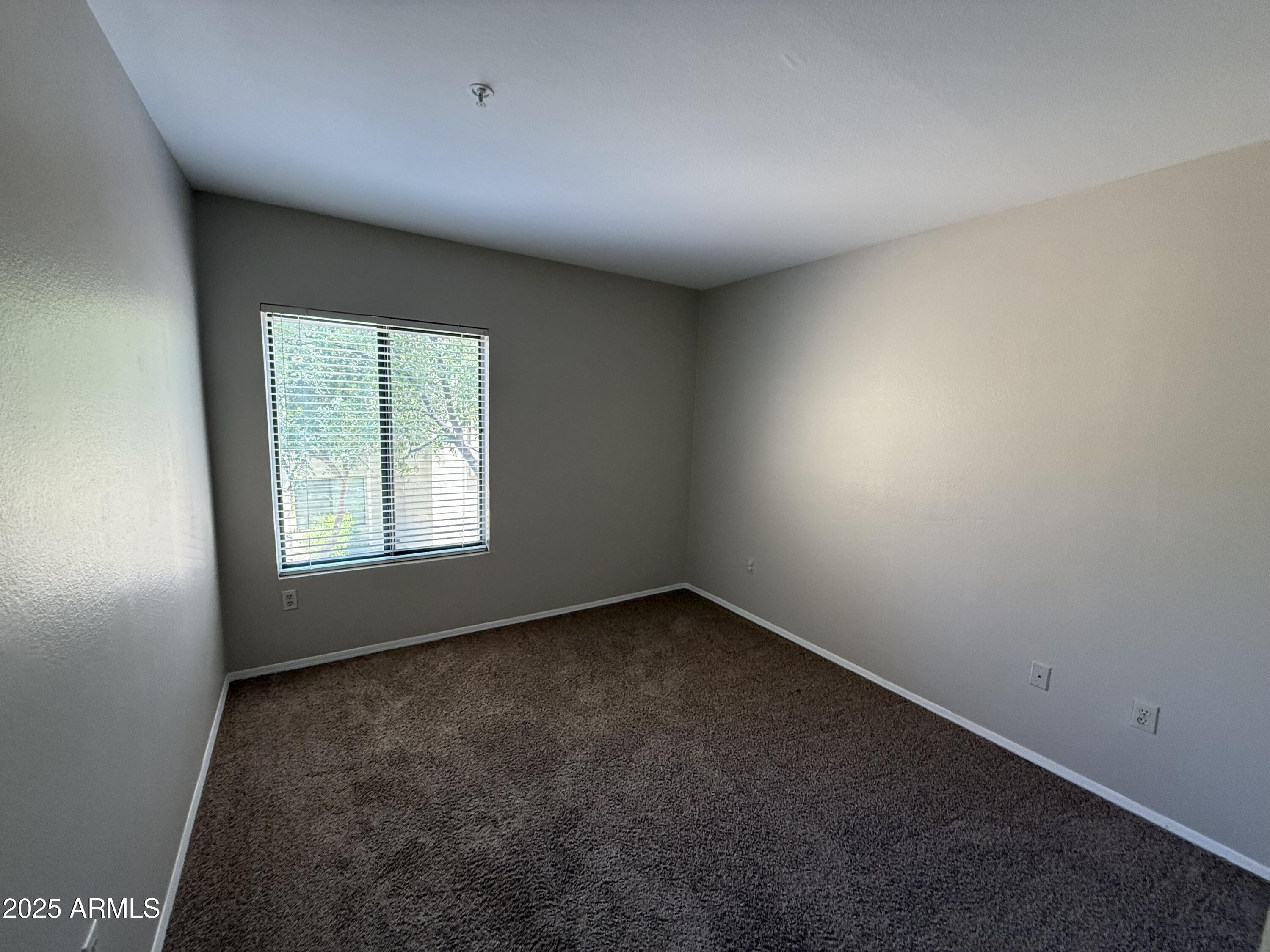 7575 East Indian Bend Road, Unit 2124 Scottsdale, AZ 85250 - Photo 13 of 32 an empty room with a window