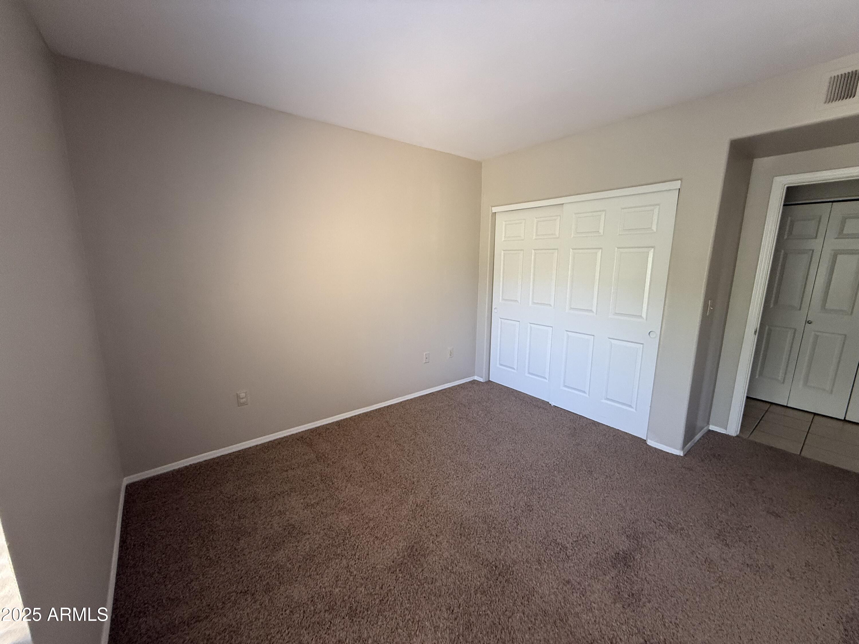 7575 East Indian Bend Road, Unit 2124 Scottsdale, AZ 85250 - Photo 14 of 32 an empty room with closet
