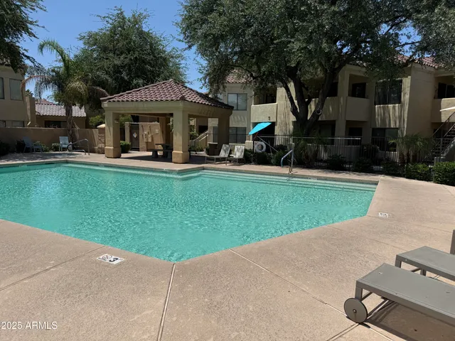 a front view of house with yard and outdoor seating