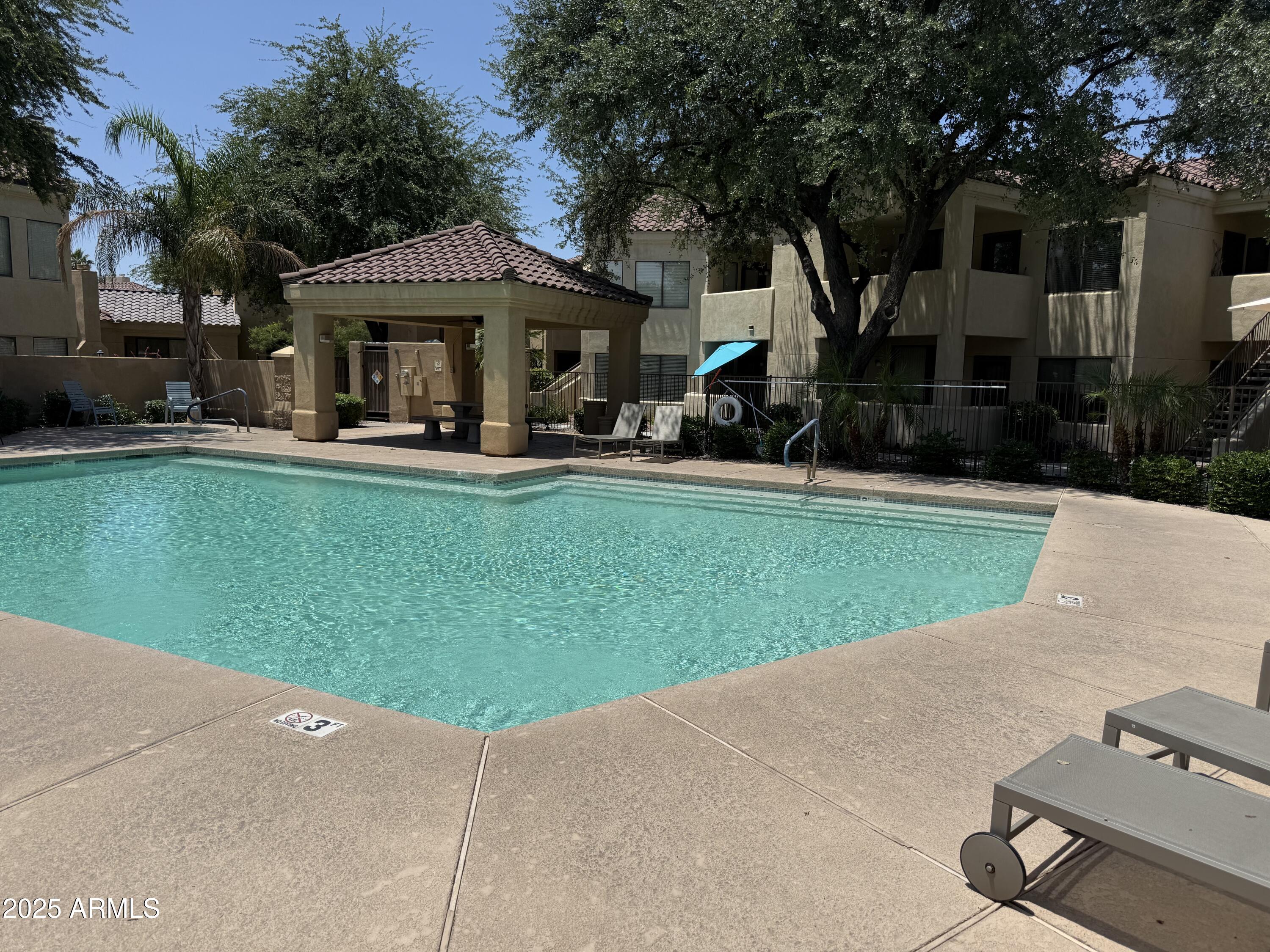 7575 East Indian Bend Road, Unit 2124 Scottsdale, AZ 85250 - Photo 16 of 32 a front view of house with yard and outdoor seating