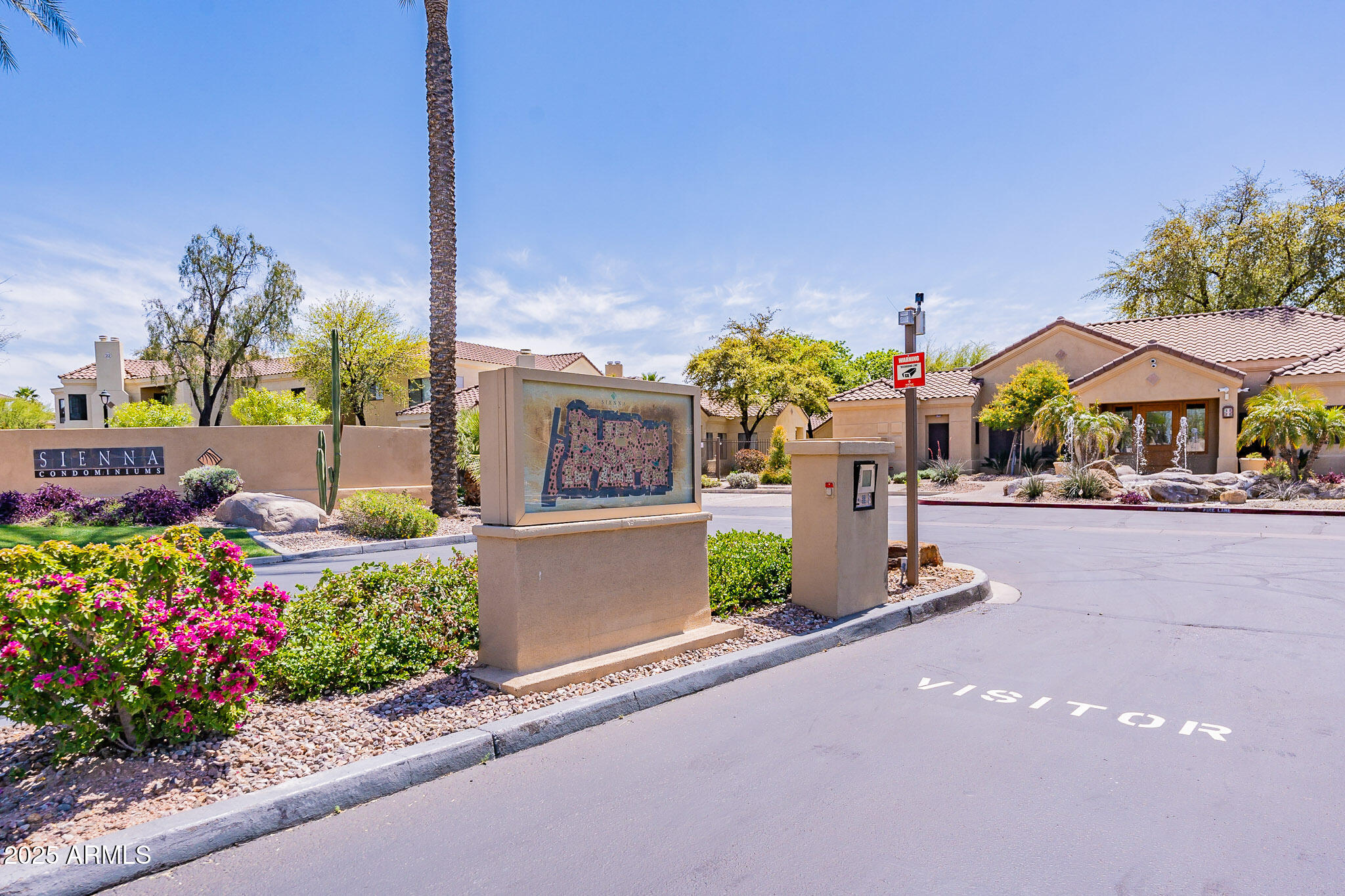 7575 East Indian Bend Road, Unit 2124 Scottsdale, AZ 85250 - Photo 20 of 32 a front view of a house with a garden and street view