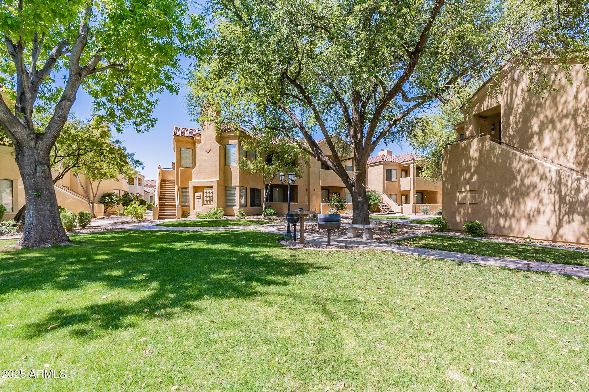 7575 East Indian Bend Road, Unit 2124 Scottsdale, AZ 85250 - Photo 24 of 32 a view of a house with a back yard