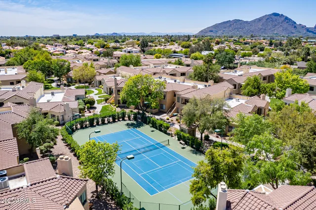 an aerial view of a house with a garden