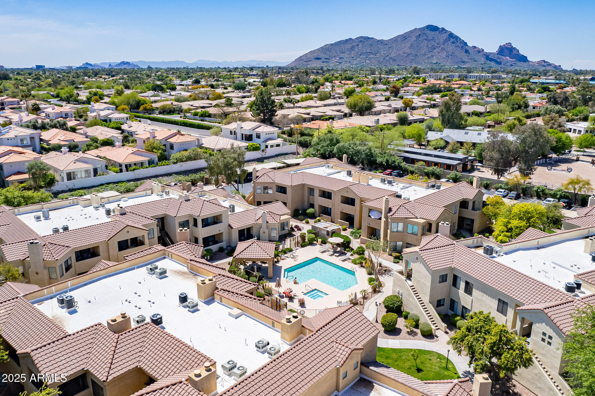 7575 East Indian Bend Road, Unit 2124 Scottsdale, AZ 85250 - Photo 28 of 32 an aerial view of a city with lots of residential buildings
